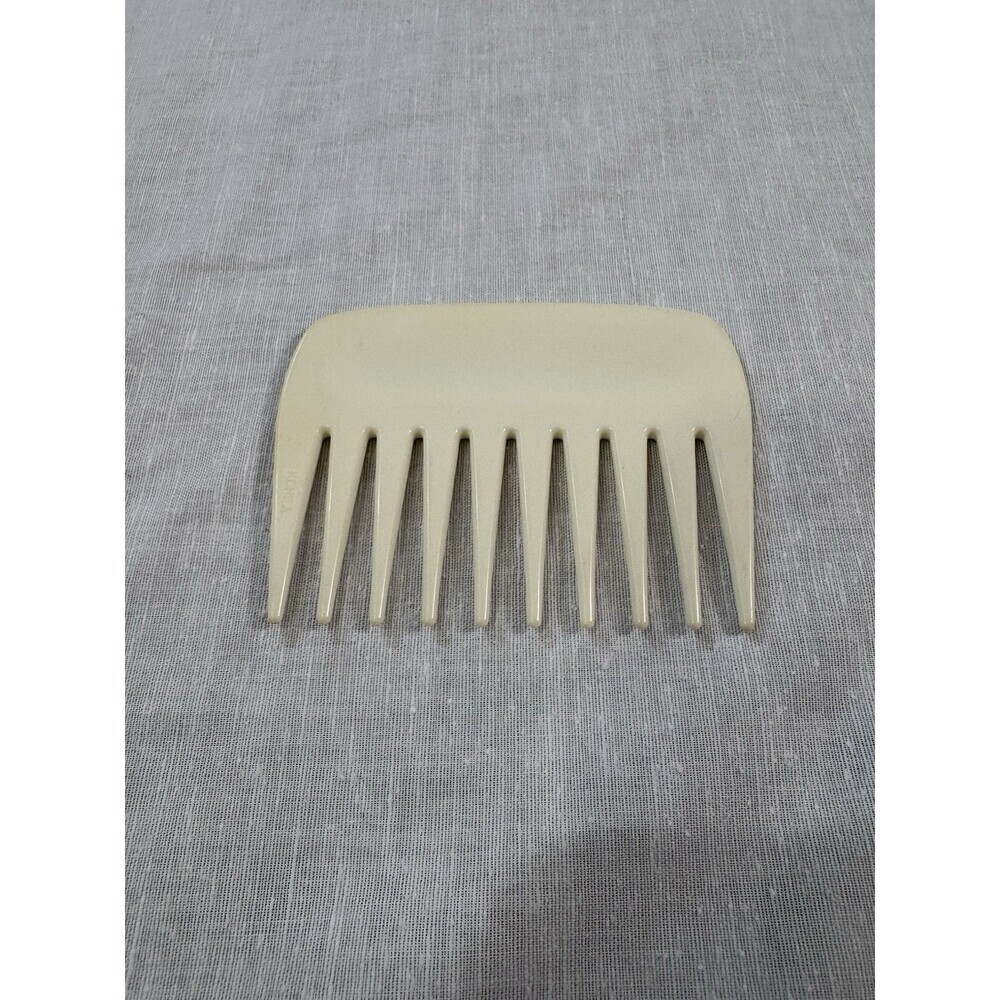 vintage unbranded cream-colored plastic hair comb 4”L X 3”W